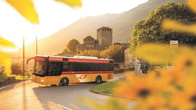 A Trasporto Pubblico del Bellinzonese Postbus with Castello Montebello in the background. 