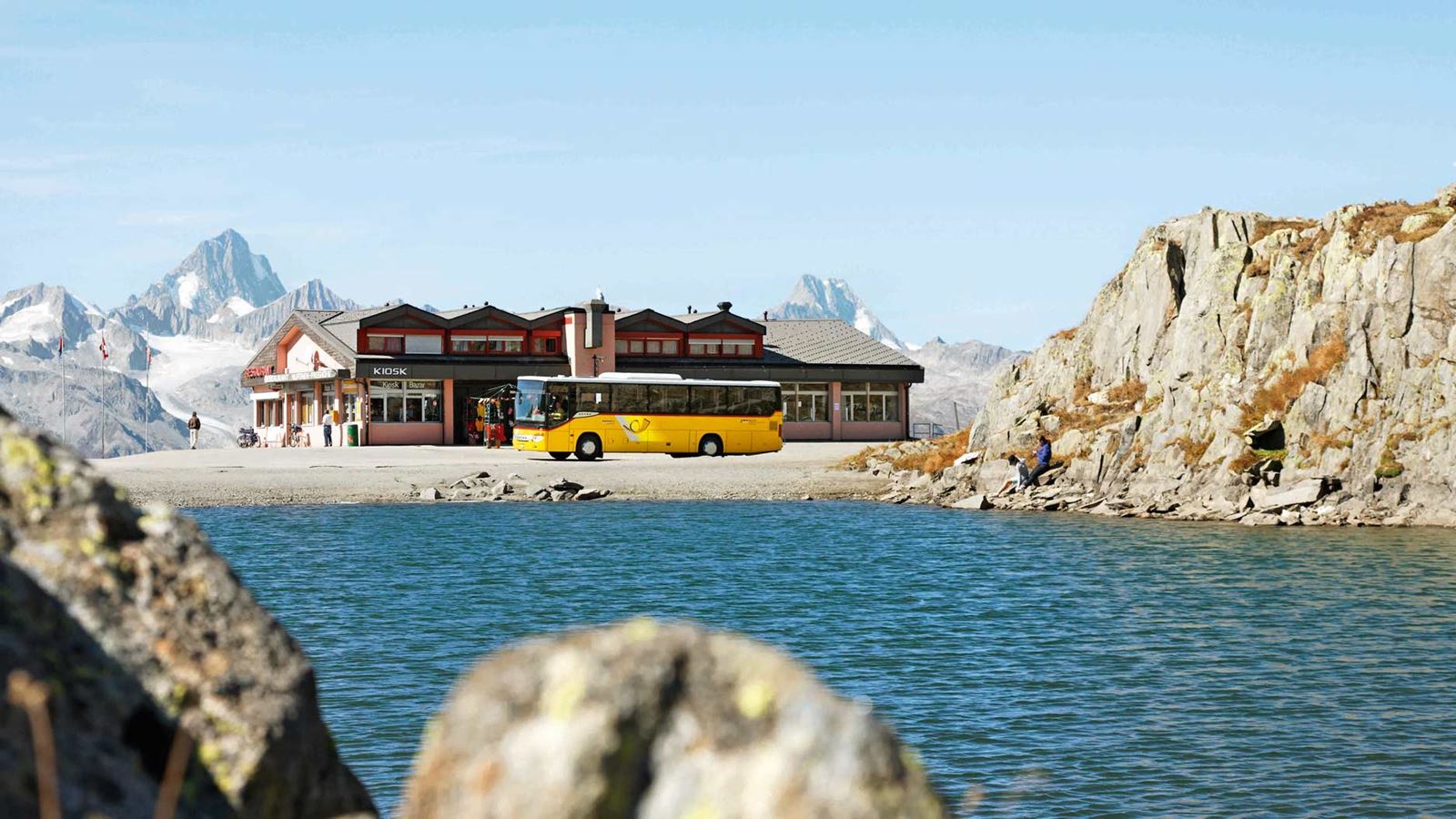 A Postbus travels over the Nufenen Pass.