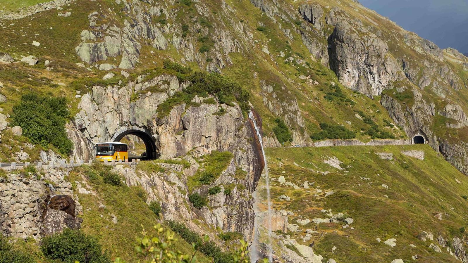A Postbus travels over the Susten Pass.