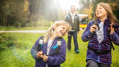 Two children laughing during an excursion to the Gantrisch region