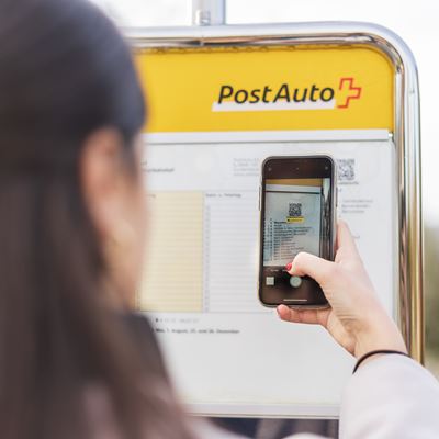 A passenger scanning a real-time QR code