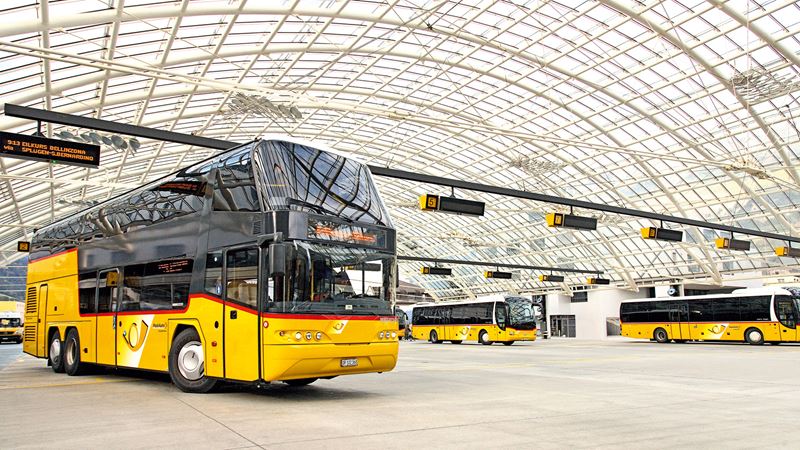 A double-decker Postbus at the Postbus station in Chur. The imposing glass dome was designed by architect Peter Rice. 